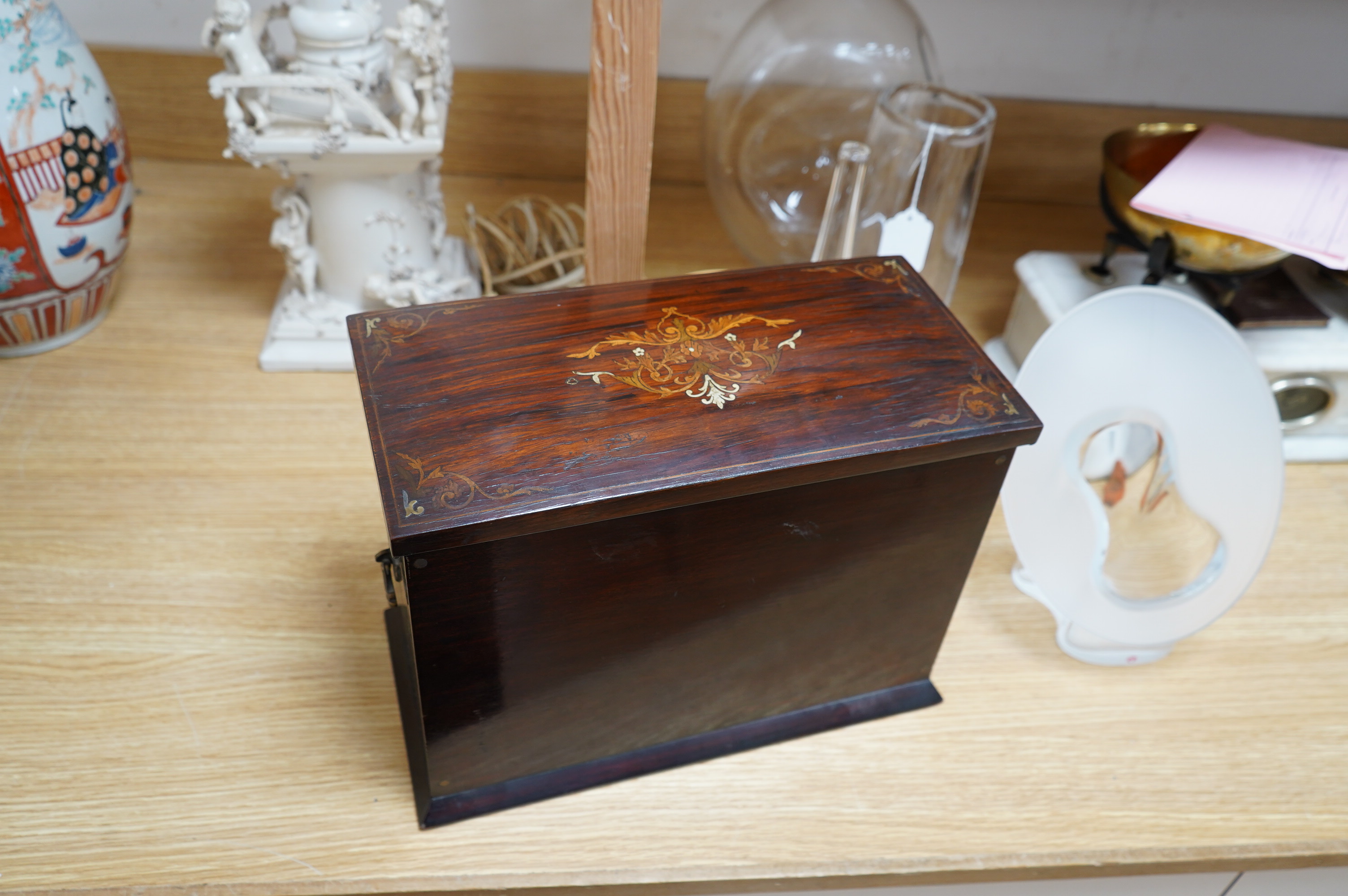 An Edwardian ivory and satinwood inlaid rosewood stationary cabinet ‘Presented to Ernest D’Auban on the occasion of his marriage from the stage staff T.R.D.L. 1906’, 35cm wide. Condition - fair. CITES Submission referenc